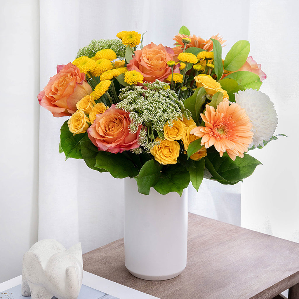 Bouquet of Free Spirit Roses, Yellow Spray Roses, Gerberas, and Pompom Mums with Lemon Leaves greeneries.