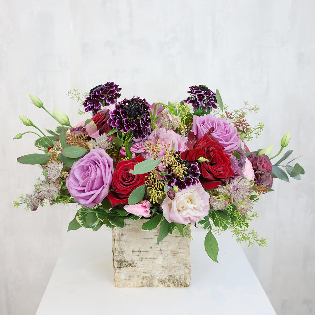 Bundle of Pink Lisianthus, Cool Water Roses, Freedom Roses, Scabiosa, and Carnations with Pittosporums and Seeded Eucalyptus greeneries.