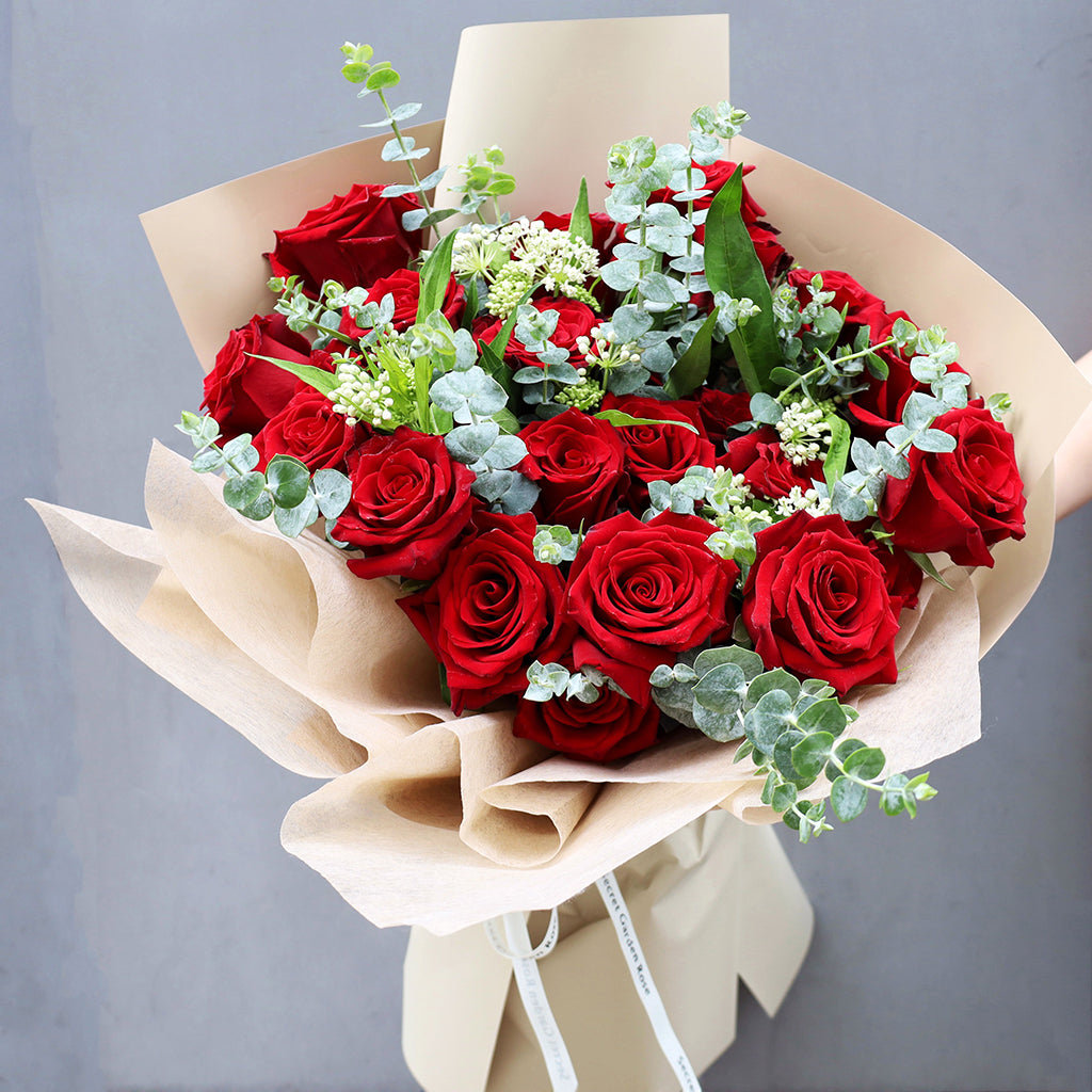 Bouquet of Premium Red Freedom Roses with Eucalyptus greeneries.