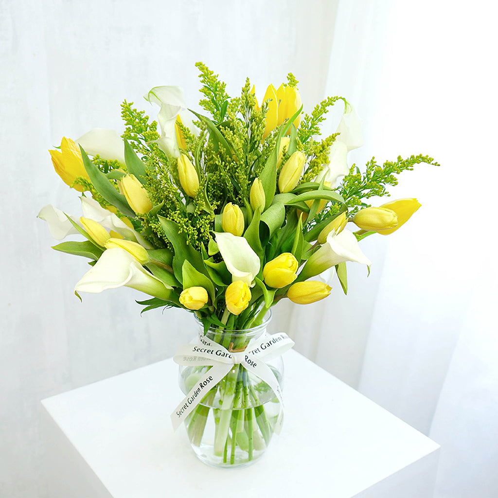 Bundle of Yellow Tulips, Calla Lilies, and Solidagos with Decorative Greens greeneries.