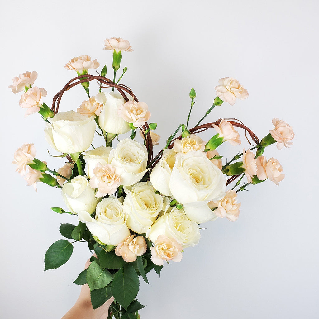 Collection of White Mondial Roses and Peach Spray Carnations.