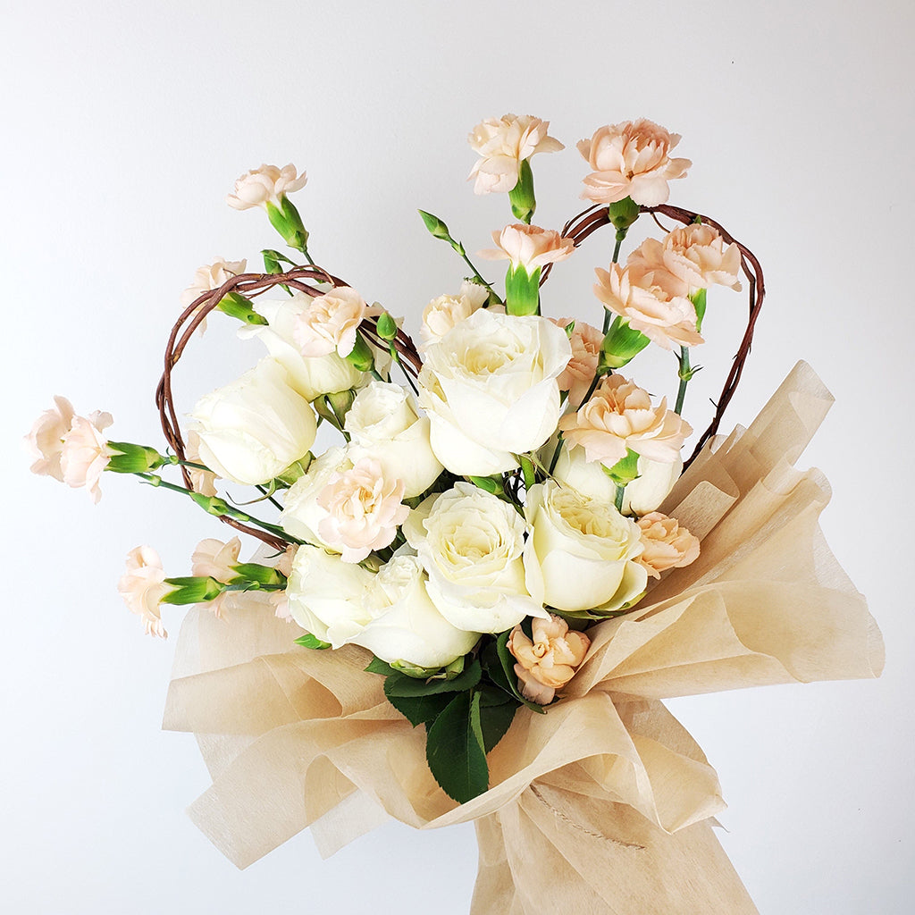 Collection of White Mondial Roses and Peach Spray Carnations.