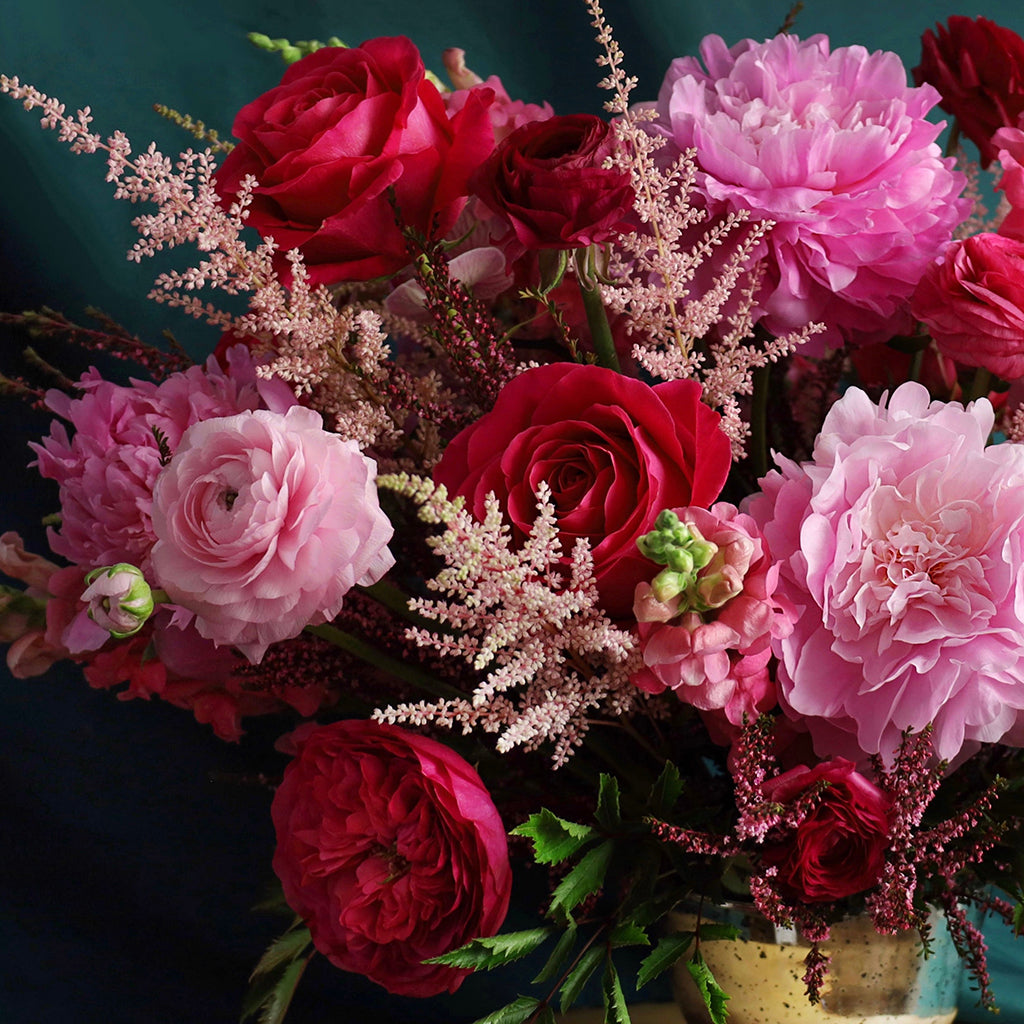 Bouquet of Hot Spot Roses, Pink Ranunculus, Darcey Garden Roses, Pink Peonies, Orchids, Snapdragons, Calycina, and Astilbes.